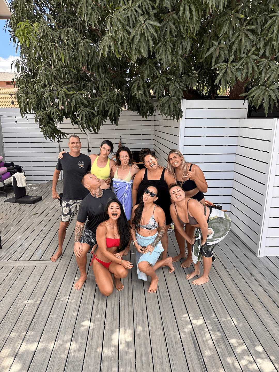 Retreat cohort gathered under the mango tree, Maui