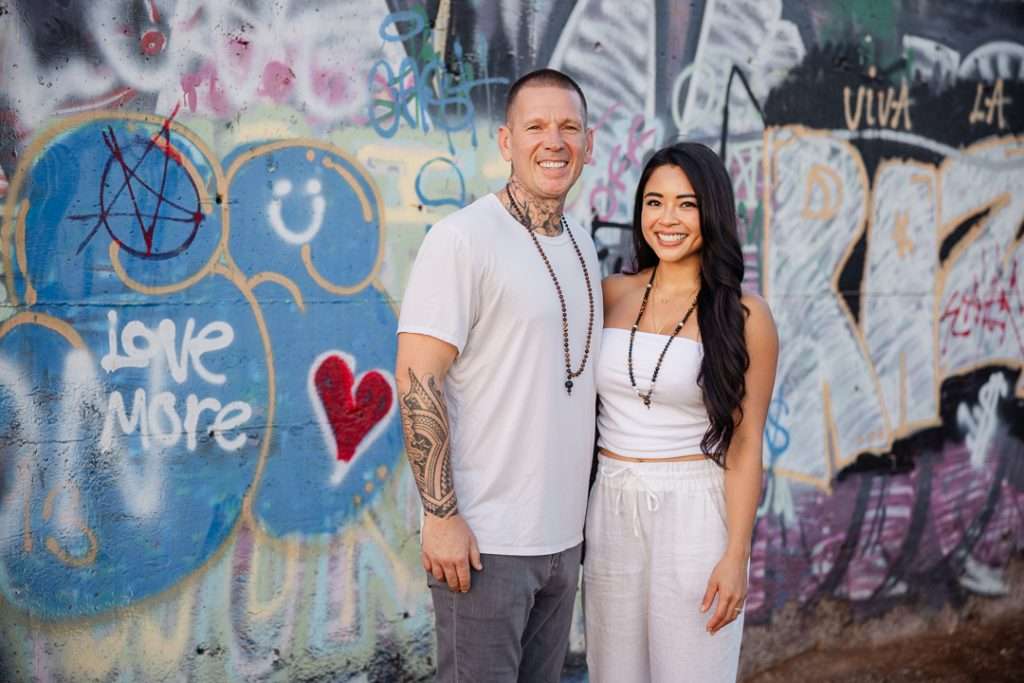 TNT and Paulina by a love-more graffiti wall in Maui