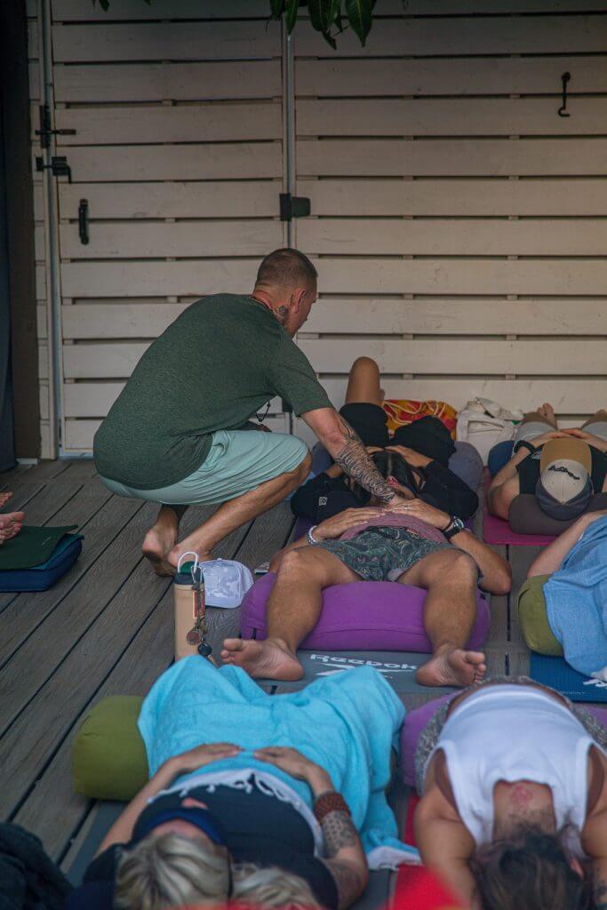 A guided breathwork session on the deck at the Oregon retreat