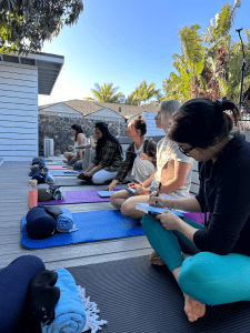 The group gathered on the deck for a morning circle