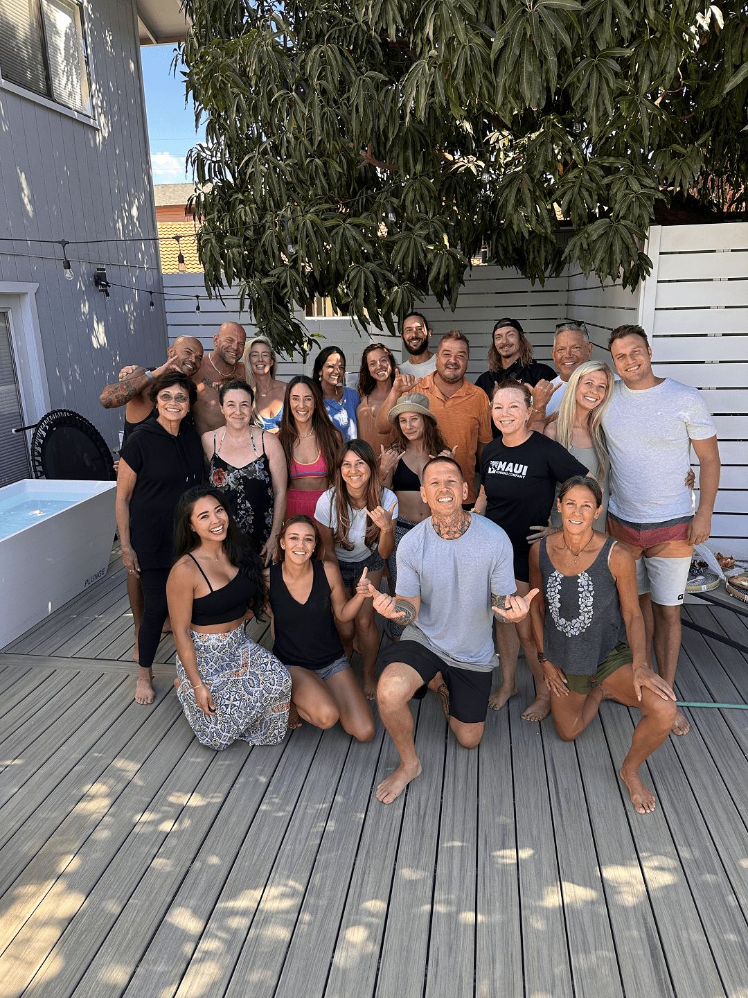 A retreat cohort gathered on the Maui deck